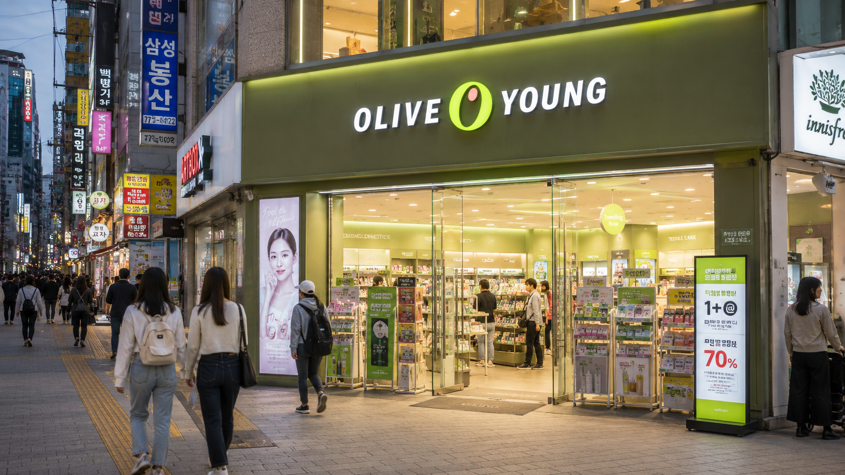 An Olive Young storefront on a busy Seoul shopping street, with the green sign clearly visible